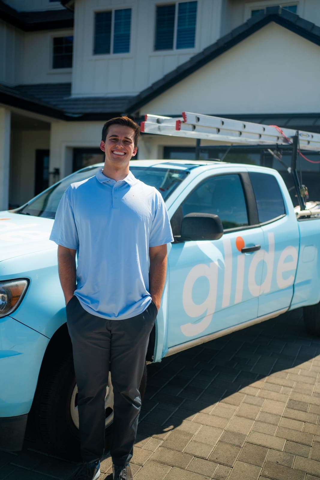 Glide service truck parked outside a home for a window cleaning visit