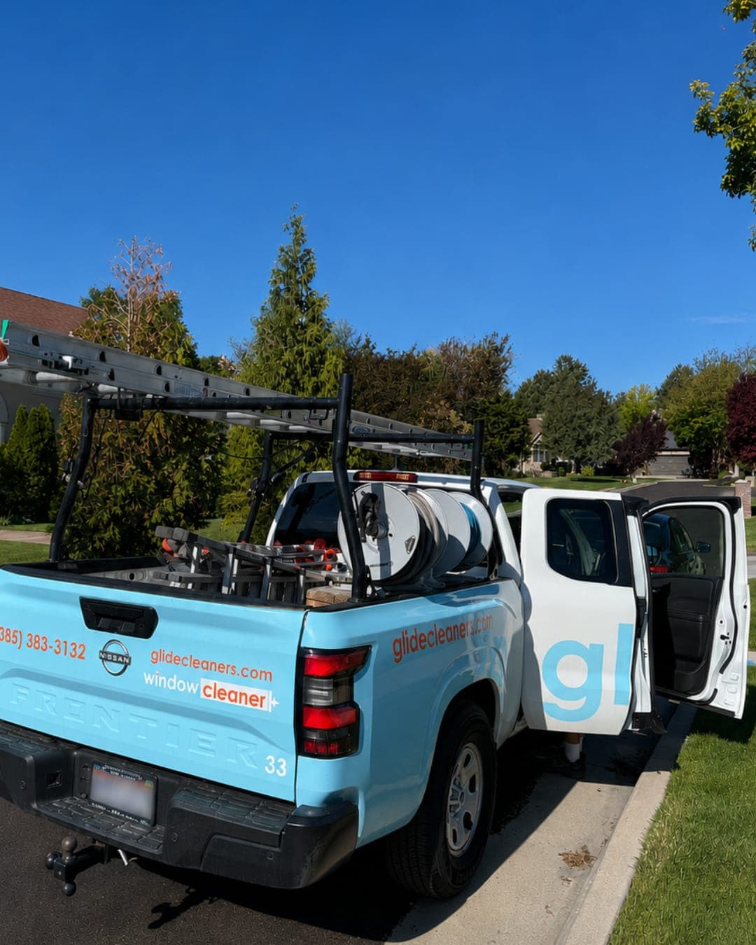 Glide technician unloading equipment from the service truck at the start of a home visit